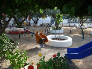 a park with a playground with a monkey statue at Zagas Hotel Ξενοδοχειο Ζάγκας in Rovies