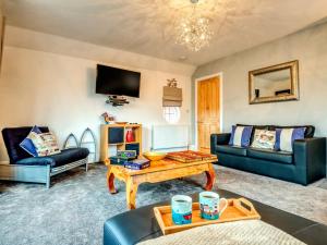 a living room with a couch and a table at 1 bed in Filey 77710 in Hunmanby
