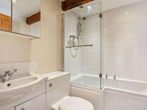 a bathroom with a toilet and a sink and a shower at 3 bed in Barnstaple 09092 in Umberleigh Bridge +5 photos