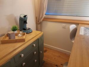 a dresser with a hair dryer on top of it at L'ANEDA Vue sur mer - COCCONING 2 Personnes - 3ème étage in Mers-les-Bains +51 photos