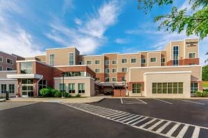 an empty parking lot in front of a building at Residence Inn by Marriott Nashua in Nashua