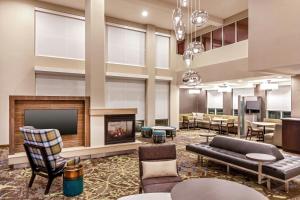a lobby with a fireplace and a waiting room at Residence Inn by Marriott Nashua in Nashua
