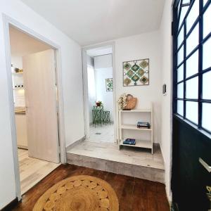 a hallway with a door leading to a room with white walls at Casa Ernestina, Apartment 2 in Asuncion