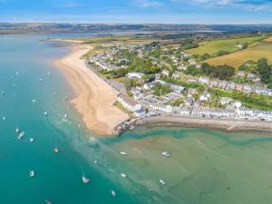 an aerial view of a beach with boats in the water at 6 Bed in Hatherleigh 79407 in Petrockstow