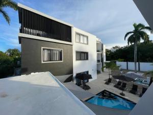 a view of a house with a swimming pool at LEVEL suites in Sosúa