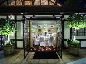 a banquet hall with white tables and chairs in a room at Peppers The Hills Lodge in Castle Hill +134 photos