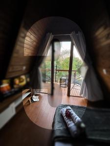 a view of a living room with a round mirror at Skychale in Governador Valadares
