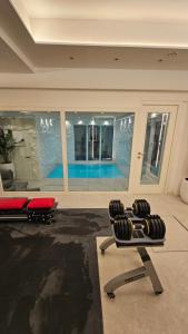 a living room with a swimming pool in a house at UG Neubau - Pool Gym Sauna extra buchbar in Munich +27 photos