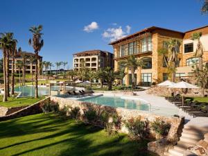 a resort with a swimming pool and a building at Sofitel La Reserva Cardales in Río Luján