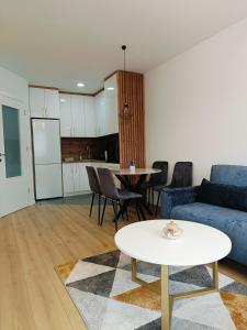 a living room with a couch and a table at Fort view in Doboj