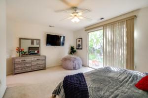 a bedroom with a bed and a tv and a dresser at 13 Mi to Slopes Cozy Home with Fenced Yard in Reno in Steamboat