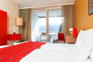 Krevet ili kreveti u jedinici u okviru objekta Post Hotel Weggis