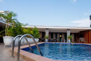 a swimming pool on top of a hotel at Presken Hotel Residence, GRA Ikeja, Lagos in Ikeja