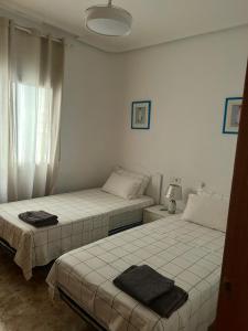 Ένα ή περισσότερα κρεβάτια σε δωμάτιο στο Maria Apartment Cabo Roig