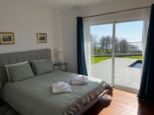 En eller flere senge i et værelse på Sunset Cottage + 61 billeder