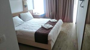 Postel nebo postele na pokoji v ubytování Villa Paradiso 2