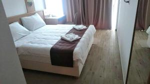 Postel nebo postele na pokoji v ubytování Villa Paradiso 2