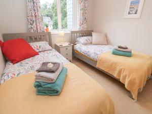 En eller flere senge i et værelse på Jaspers Retreat, formerly known as Starfish Cottage + 37 billeder