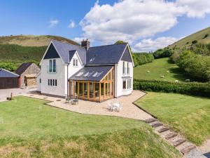 a large white house with a large yard at 4 Bed in Llanidloes 51651 in Llandinam