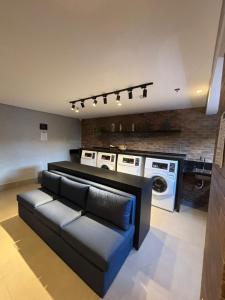 Un lugar para sentarse en Studio aconchegante de 1 quarto com vaga grátis - 10min do Allianz Parque