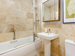 a bathroom with a sink and a shower and a toilet at 2 Bed in Keswick LCC19 in Applethwaite +19 photos