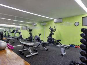 a gym with several exercise bikes in a room at Novotel Suva Lami Bay in Suva
