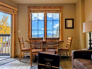 a living room with a table and chairs and a window at Dakota Lodge 8503 by SummitCove Lodging in Colorado in Keystone +46 photos