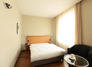 Postelja oz. postelje v sobi nastanitve GLANDON Rooms Elite