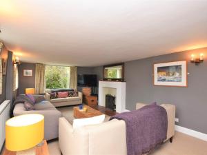a living room with couches and a fireplace at 4 Bed in Ningwood IC048 in Newbridge