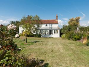 a white house with a yard in front of it at 4 Bed in Ningwood IC048 in Newbridge
