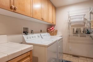 a laundry room with a washer and dryer at Snowcreek V 756 in Mammoth Lakes