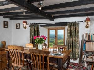 a dining room with a wooden table and chairs at 3 Bed in Dorstone BN070 in Hardwicke +18 photos