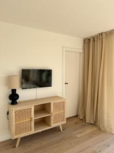 Et tv og/eller underholdning på Ferienhaus Weststrandhaus Großenbrode