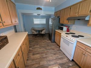 a kitchen with a white stove and a table at MinCo Properties WV, Carswell Hollow Overlook in Kimball