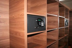 a built in book shelf with a tv in it at Stadthotel Bernstein in Regensburg