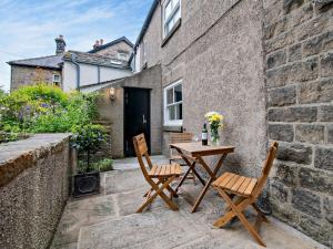 a table and chairs on the patio of a house at 3 Bed in Bamford PK838 in Bamford