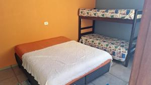 Ένα ή περισσότερα κρεβάτια σε δωμάτιο στο Família Motta