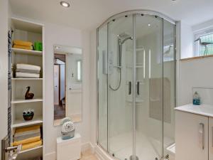 a glass shower in a bathroom with a sink at 1 bed property in Cromer 48723 in Bacton +14 photos