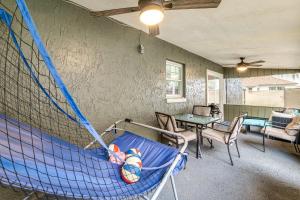 a net in a room with a table and chairs at 9 Mi to Legoland Family Gem with Games Galore! in Eagle Lake