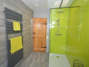 a bathroom with a shower and a glass door at 2 Bed in Keswick 88864 in Keswick +15 photos