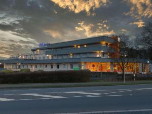 a building on the side of a street at ibis budget Hotel BONN SÜD Königswinter in Königswinter