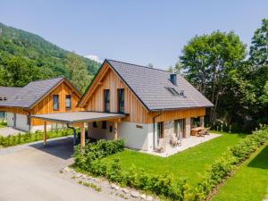 an exterior view of a house with a roof at Mountain Chalet Arnica in Sankt Lorenzen ob Murau
