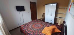 Postel nebo postele na pokoji v ubytování Quarto na praia da Pinheira