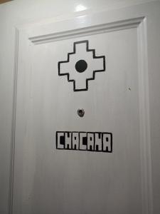 a white door with a chicago sign on it at Hospedaje Maité in Santa María