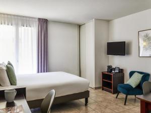 TV a/nebo společenská místnost v ubytování Aparthotel Adagio Access Nice Garibaldi