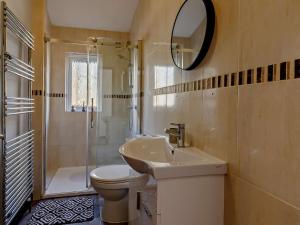 a bathroom with a sink and a toilet and a shower at 2 Bed in Sidmouth 91118 in Ottery Saint Mary +16 photos