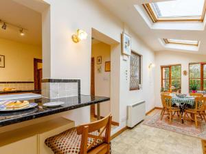 a kitchen with a counter and a dining room at 3 Bed in Shipston-on-Stour 90481 in Honington