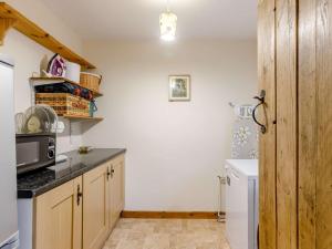 a kitchen with a sink and a microwave at 3 Bed in Shipston-on-Stour 90481 in Honington +18 photos