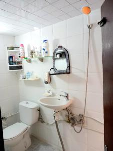 a bathroom with a toilet and a sink at Hadi house in Fès +17 photos