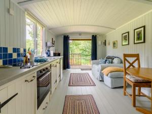 a kitchen and living room with a couch at 1 Bed in Narberth 88421 in Jeffreston +24 photos